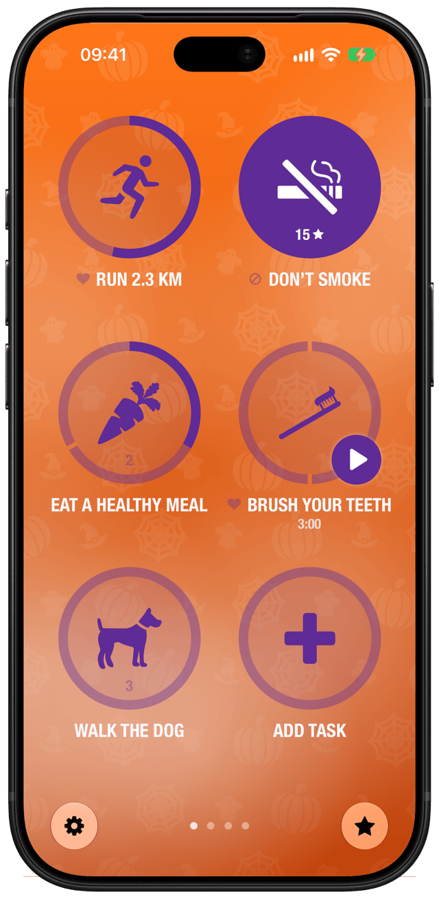 Streaks with the Halloween theme: pumpkins, spiderwebs and bats behind orange and purple tasks